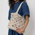 The Sak Sola Carryall Tote - Hand Crochet - Natural Multi Flowers